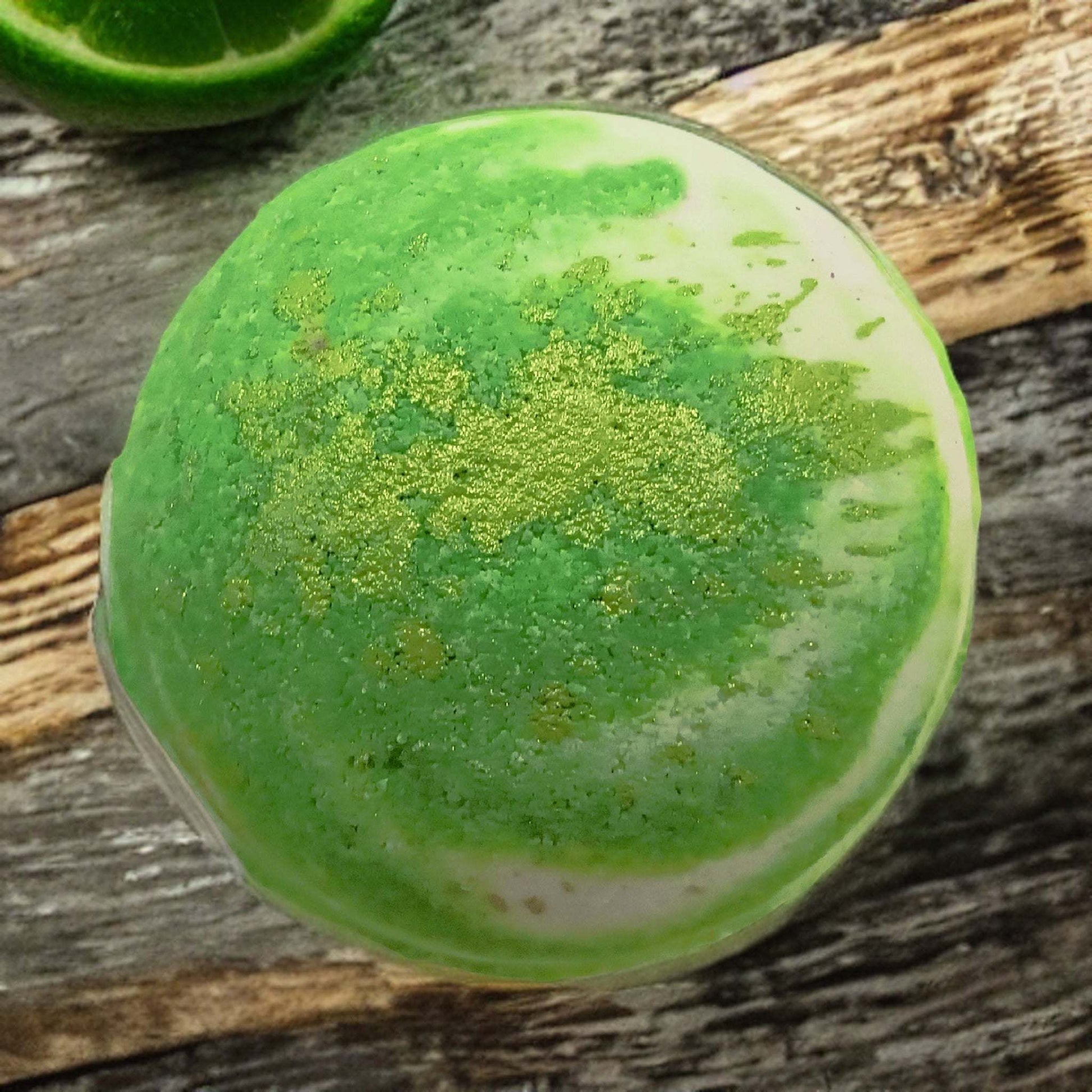 Unleash your senses with our Frozen Lime Margarita Fizzy Bath Bomb. Luxurious relaxation awaits you.